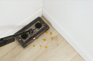 Cleaning close to baseboards with Swivel Sweeper Turbo S